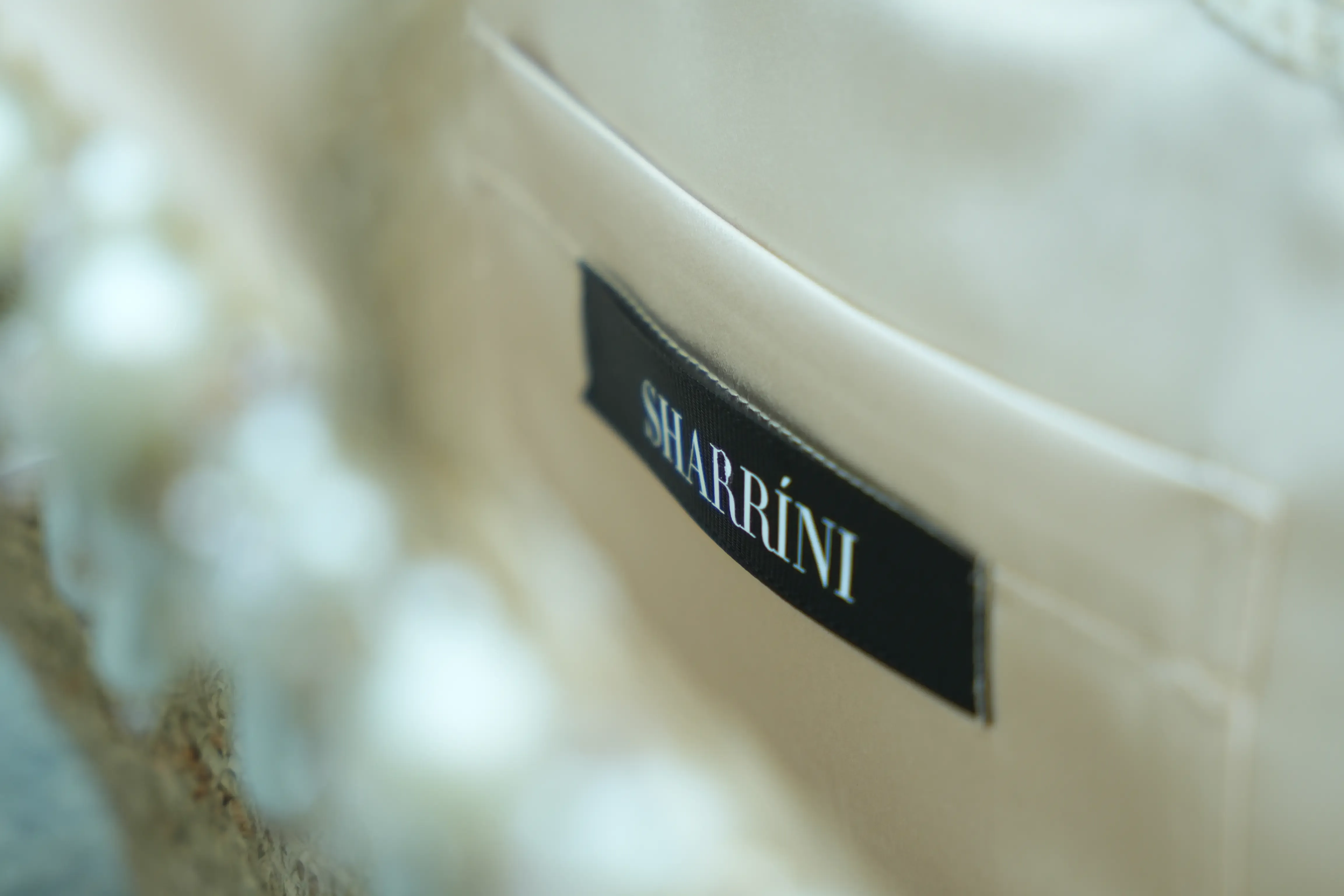 Pearl and bead details on a Sharrini dress